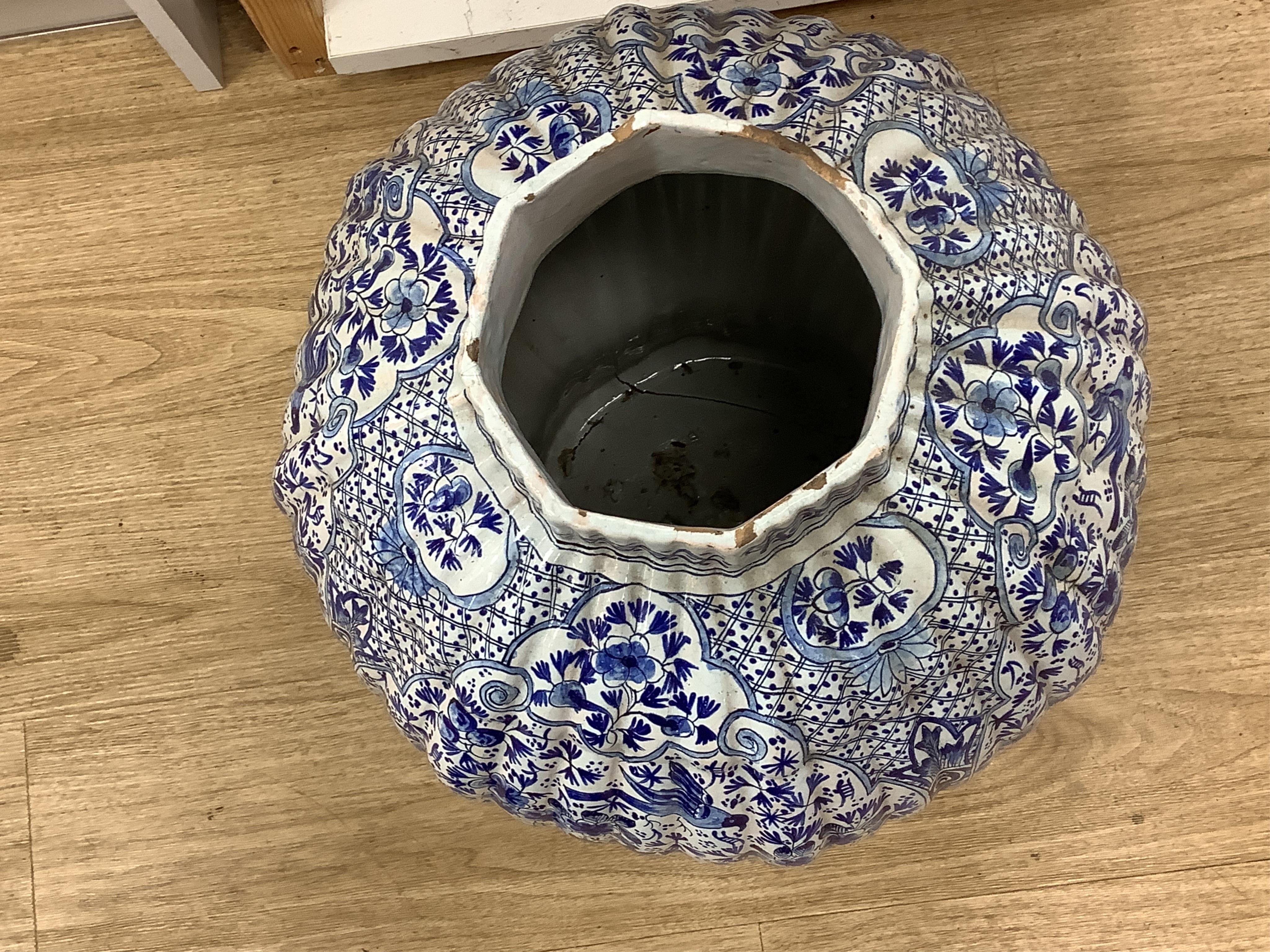 A large Delft blue and white vase and cover, 65cm tall